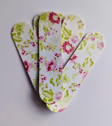 Cutouts of faux leather tidy before adding the snaps