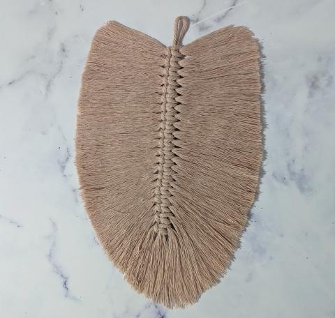 Pink macramé feather. This was my first attempt at macramé.